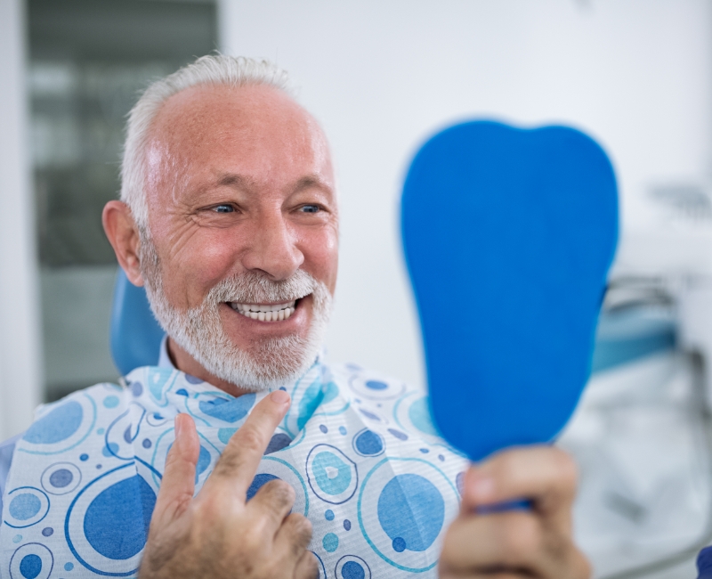 Man smiling after routine dental office visit