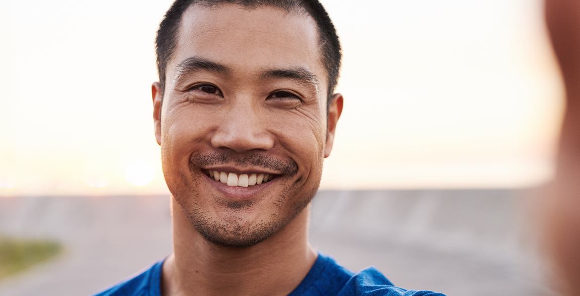 closeup of young man smiling 